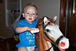 17 month old Bryson riding his pony after waking up!